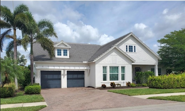14835 Dockside Ln, Naples, FL 34114 - view of front of house featuring decorative driveway and stucco siding