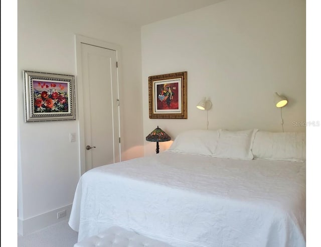 14835 Dockside Ln, Naples, FL 34114 - bedroom with carpet flooring and baseboards