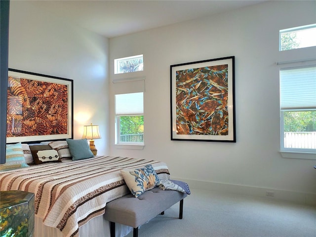 14835 Dockside Ln, Naples, FL 34114 - bedroom featuring multiple windows, carpet, and baseboards