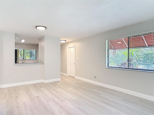 1591 Revere Ln, Daytona Beach, FL 32117 - empty room featuring light wood finished floors and baseboards