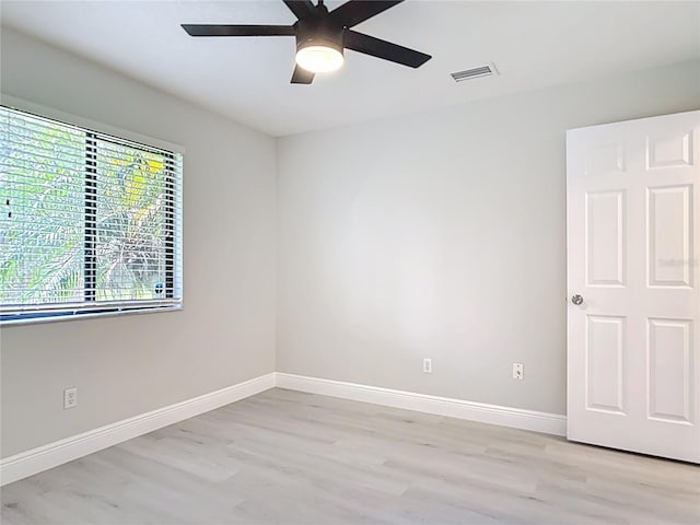 1591 Revere Ln, Daytona Beach, FL 32117 - spare room with light wood-type flooring, baseboards, and a ceiling fan