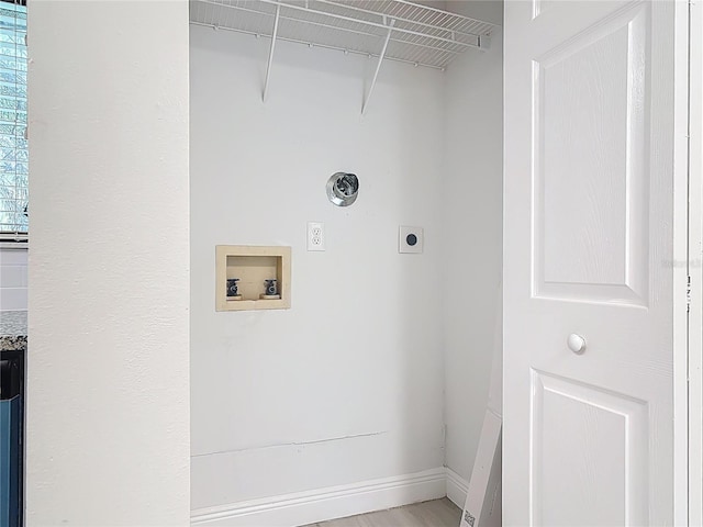 1591 Revere Ln, Daytona Beach, FL 32117 - laundry room featuring hookup for an electric dryer, hookup for a washing machine, and baseboards