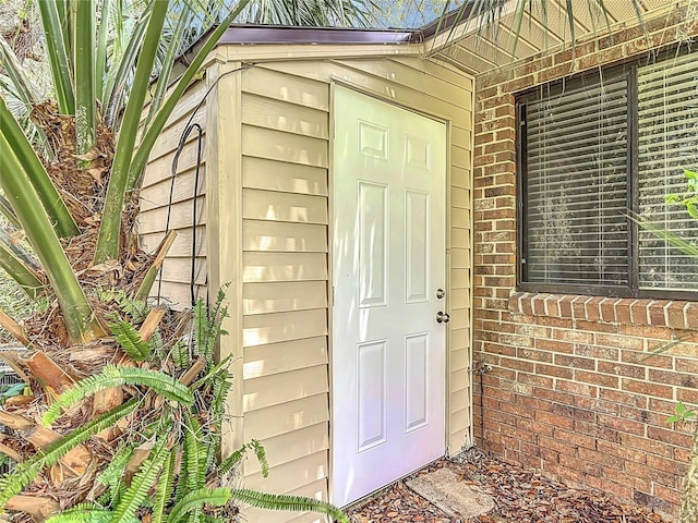 1591 Revere Ln, Daytona Beach, FL 32117 - doorway to property featuring brick siding