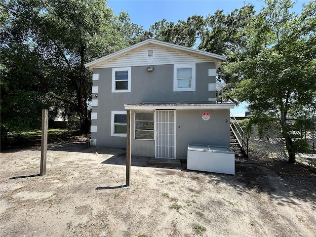 1238 Conley St, Orlando, FL 32805 - view of front of property with stucco siding and stairway