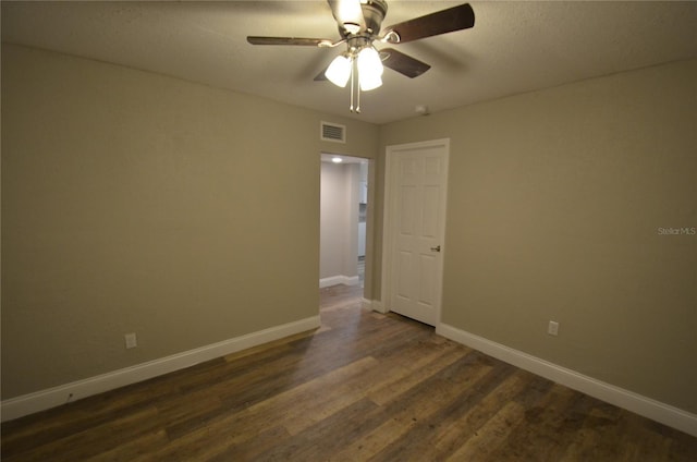 1238 Conley St, Orlando, FL 32805 - unfurnished room with a ceiling fan, dark wood-style floors, and baseboards