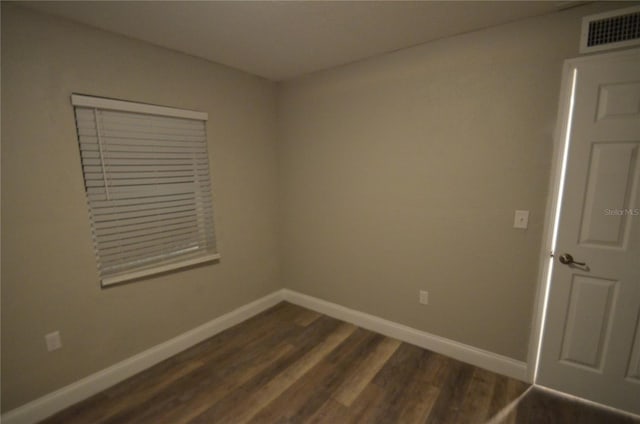 1238 Conley St, Orlando, FL 32805 - spare room featuring dark wood finished floors and baseboards