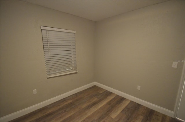 1238 Conley St, Orlando, FL 32805 - empty room with dark wood finished floors and baseboards