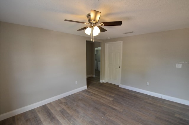 1238 Conley St, Orlando, FL 32805 - spare room with dark wood-style floors, baseboards, and a ceiling fan