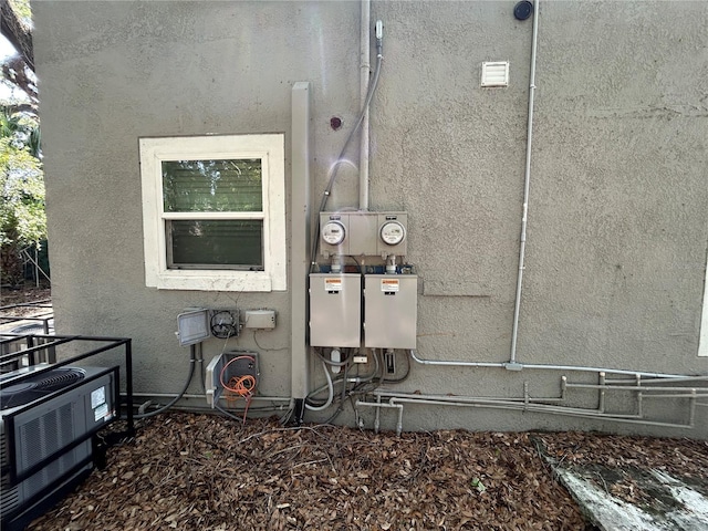 1238 Conley St, Orlando, FL 32805 - exterior view of stucco siding and electric meter
