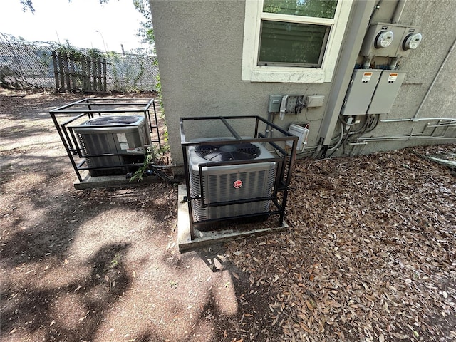 1238 Conley St, Orlando, FL 32805 - exterior view of central AC, fence, and electric meter