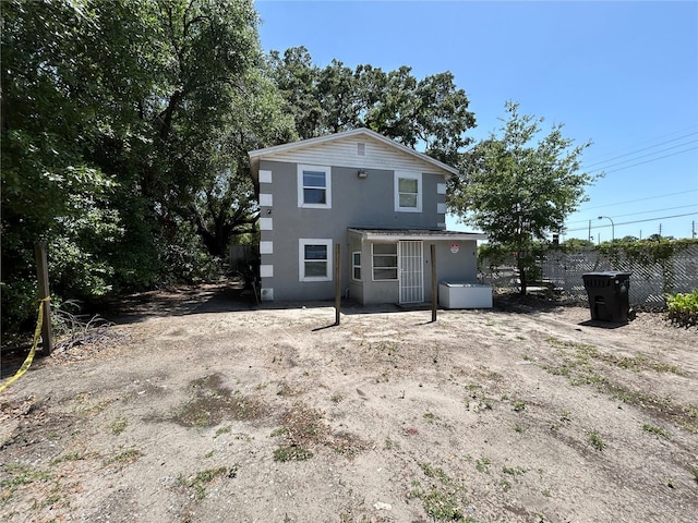 1238 Conley St, Orlando, FL 32805 - rear view of house featuring stucco siding and fence