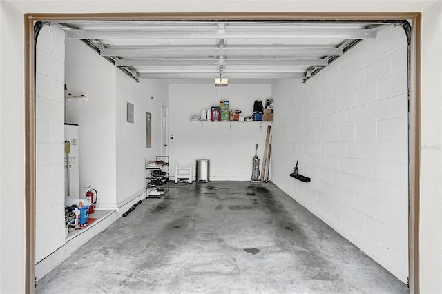 garage with electric water heater, electric panel, concrete block wall, and a garage door opener