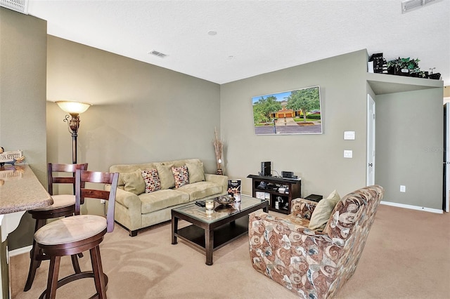 living area with light carpet and baseboards