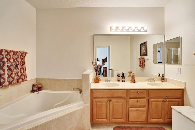 bathroom featuring a bath and double vanity