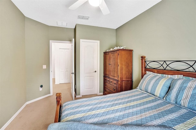 carpeted bedroom with baseboards and ceiling fan