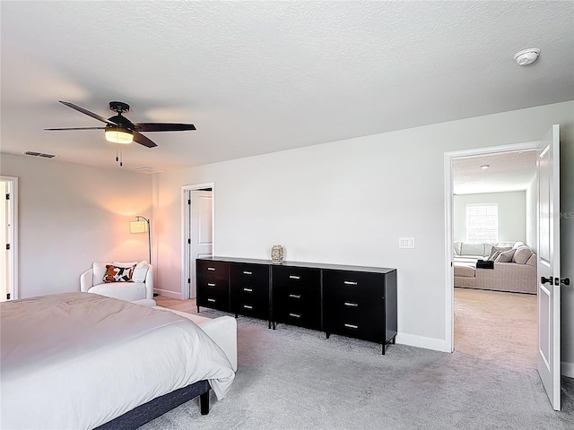 2943 Slough Creek Dr, Kissimmee, FL 34744 - bedroom featuring light carpet, a ceiling fan, and baseboards