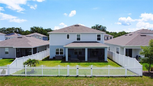 2943 Slough Creek Dr, Kissimmee, FL 34744 - back of house featuring a sunroom and roof with shingles