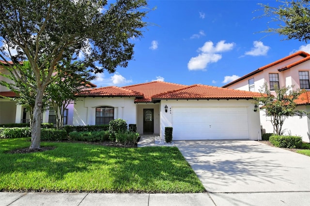446 Summer Place Loop, Clermont, FL 34714 - mediterranean / spanish-style home with an attached garage, a tiled roof, stucco siding, and driveway