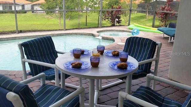 446 Summer Place Loop, Clermont, FL 34714 - view of pool with glass enclosure, a patio area, a pool with connected hot tub, and a yard
