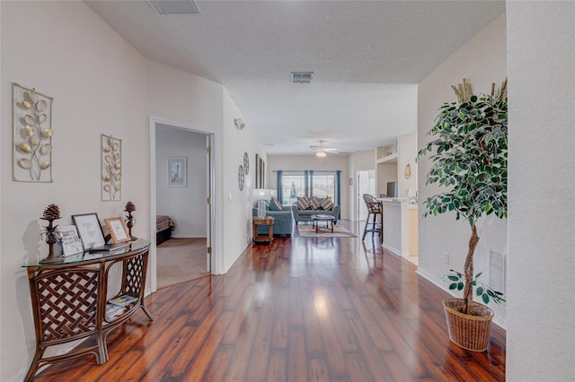 446 Summer Place Loop, Clermont, FL 34714 - hallway with wood finished floors, baseboards, and a textured ceiling