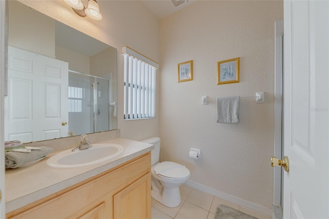 446 Summer Place Loop, Clermont, FL 34714 - full bathroom with a shower stall, tile patterned floors, toilet, vanity, and baseboards