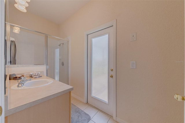 446 Summer Place Loop, Clermont, FL 34714 - bathroom featuring a shower stall, tile patterned floors, baseboards, and vanity