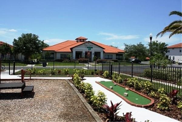 446 Summer Place Loop, Clermont, FL 34714 - view of home's community featuring a putting area and fence