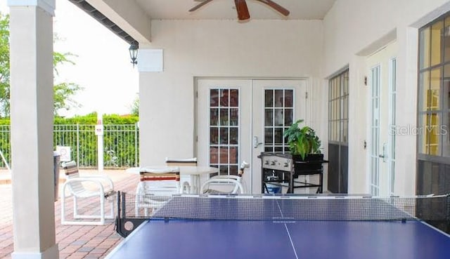 446 Summer Place Loop, Clermont, FL 34714 - rec room featuring french doors, ceiling fan, and brick patterned floors