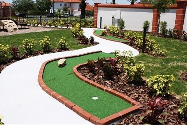 446 Summer Place Loop, Clermont, FL 34714 - view of yard featuring an area to practice putting and fence