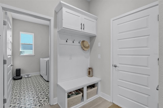 14925 Lebeau Loop, Winter Garden, FL 34787 - mudroom featuring washer and clothes dryer and baseboards