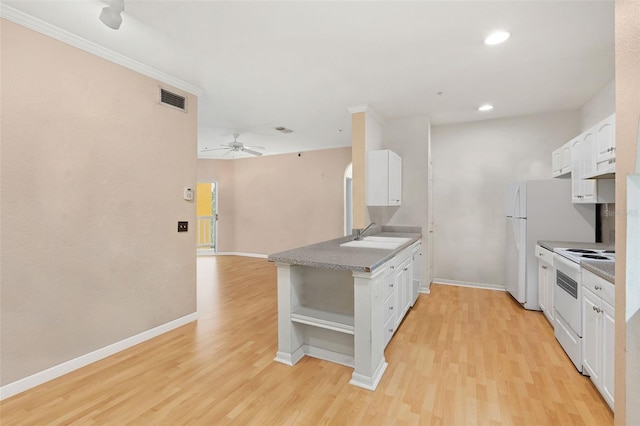 kitchen featuring white appliances, open shelves, light wood-style flooring, white cabinets, and recessed lighting