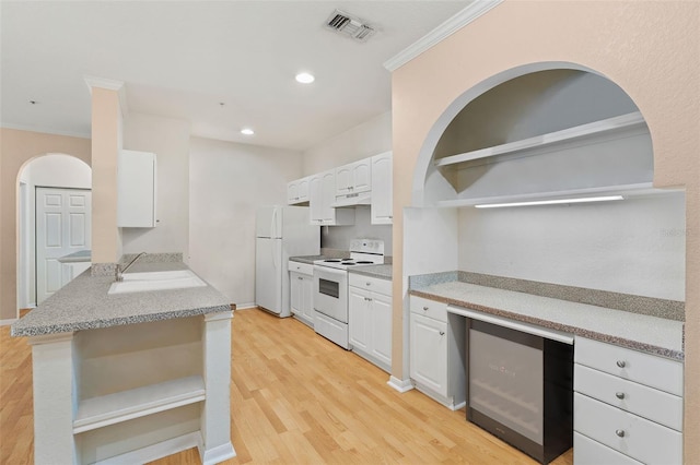 kitchen with open shelves, white appliances, a sink, white cabinets, and light wood finished floors