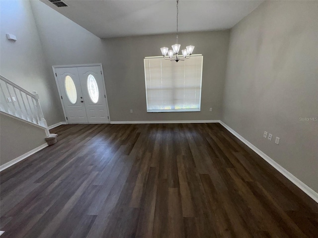 3707 Andover Cay Blvd, Orlando, FL 32825 - entryway with a chandelier, baseboards, dark wood-style floors, stairs, and vaulted ceiling