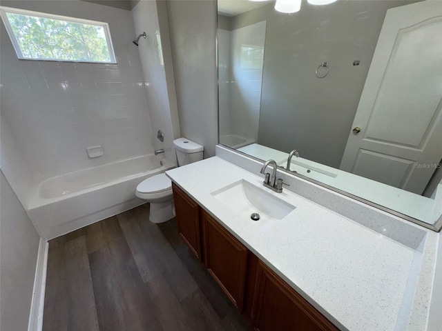 3707 Andover Cay Blvd, Orlando, FL 32825 - bathroom featuring wood finished floors, toilet, vanity, and bathtub / shower combination
