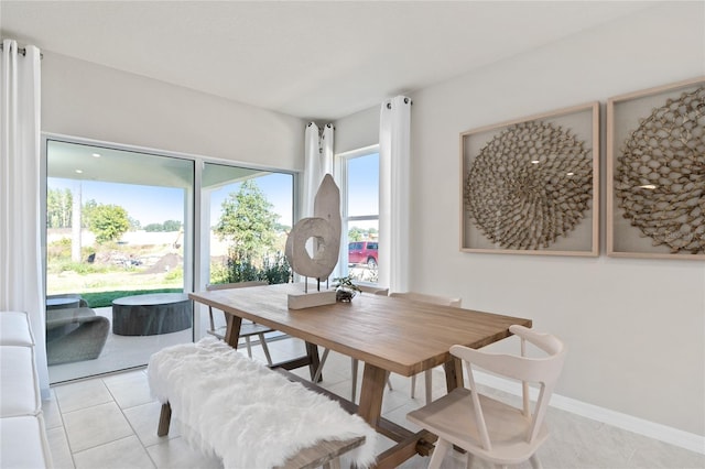 dining area with light tile patterned flooring