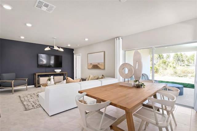 dining space featuring recessed lighting and light tile patterned floors