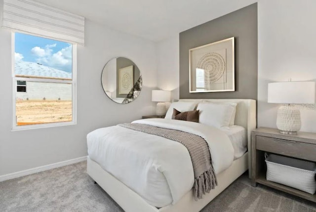 carpeted bedroom with baseboards