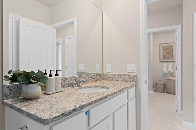 bathroom featuring vanity and baseboards