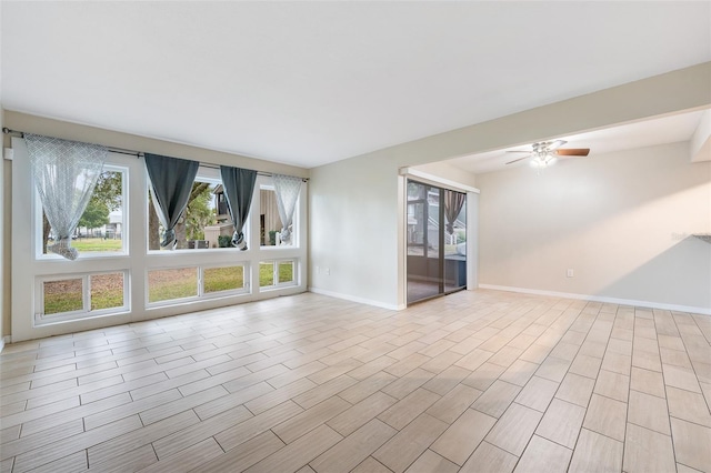 5071 Eaglesmere Dr Unit C01, Orlando, FL 32819 - empty room featuring baseboards, ceiling fan, and light wood-type flooring