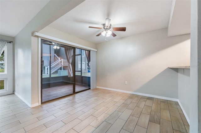 5071 Eaglesmere Dr Unit C01, Orlando, FL 32819 - unfurnished room with a ceiling fan, wood tiled floors, and baseboards