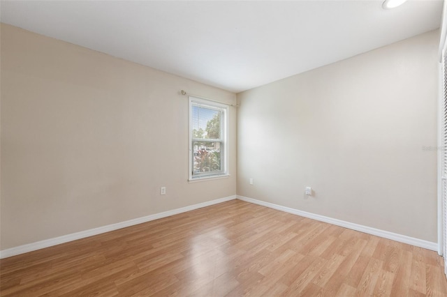 5071 Eaglesmere Dr Unit C01, Orlando, FL 32819 - unfurnished room featuring light wood finished floors and baseboards