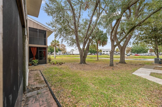 5071 Eaglesmere Dr Unit C01, Orlando, FL 32819 - view of grassy yard with central air condition unit