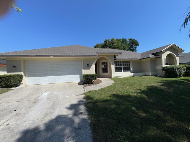 7507 Sandstone Dr, Orlando, FL 32836 - ranch-style home with stucco siding, concrete driveway, an attached garage, and a front lawn