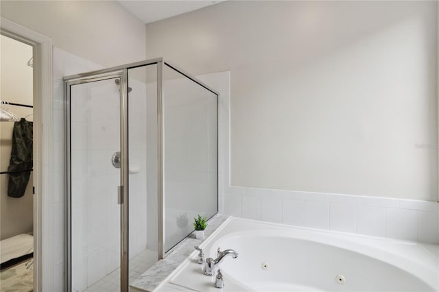 7551 Bear Claw Run, Orlando, FL 32825 - full bathroom featuring a whirlpool tub and a shower stall