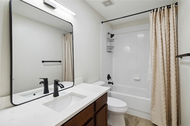7551 Bear Claw Run, Orlando, FL 32825 - bathroom featuring toilet, vanity, shower / bath combo with shower curtain, and wood finished floors