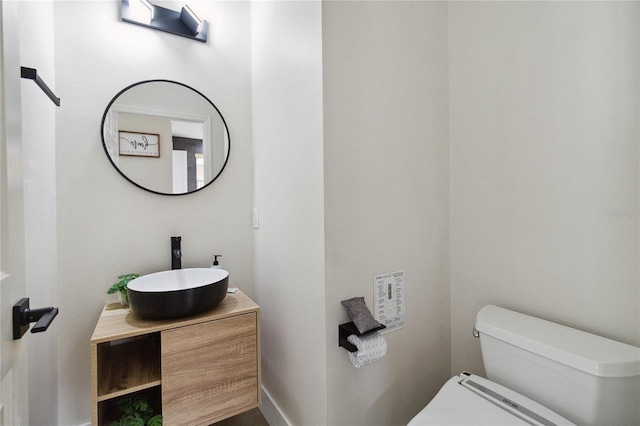 7551 Bear Claw Run, Orlando, FL 32825 - bathroom featuring toilet, vanity, and baseboards