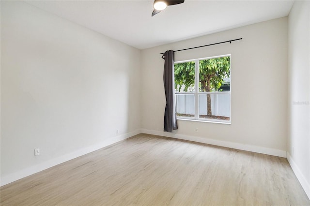 7551 Bear Claw Run, Orlando, FL 32825 - spare room with wood finished floors, baseboards, and a ceiling fan