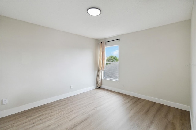 7551 Bear Claw Run, Orlando, FL 32825 - unfurnished room with light wood-style flooring and baseboards