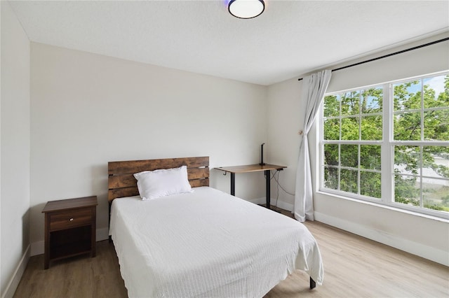 7551 Bear Claw Run, Orlando, FL 32825 - bedroom featuring baseboards and wood finished floors