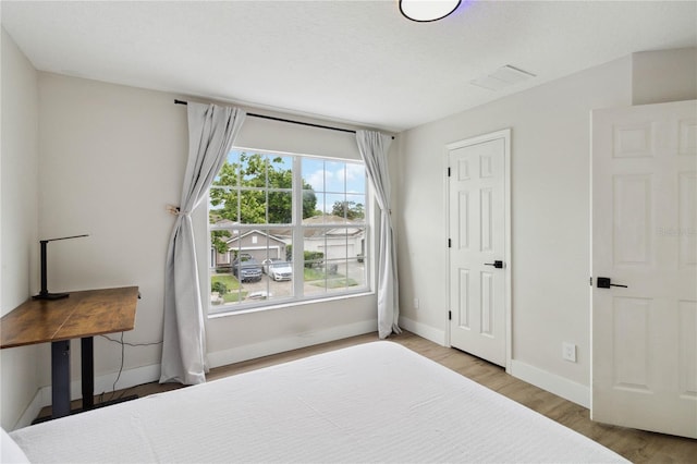 7551 Bear Claw Run, Orlando, FL 32825 - bedroom with wood finished floors and baseboards